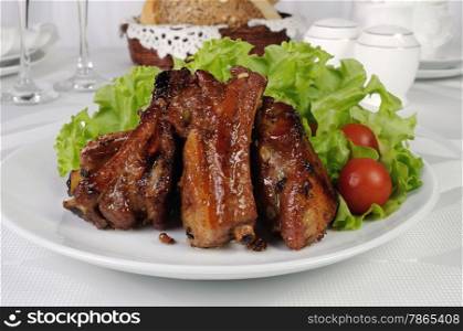 Pork ribs in honey and soy sauce with garlic
