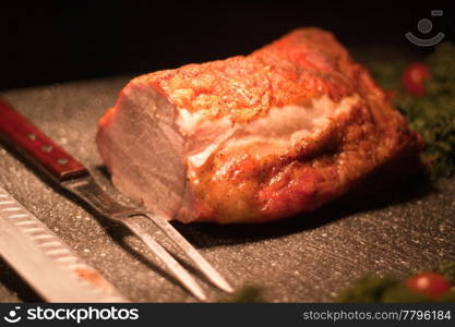 pork roast on carving station with decoration