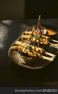 Pork satay ,Grilled pork served with peanut sauce or sweet and sour sauce ,Asian food style 