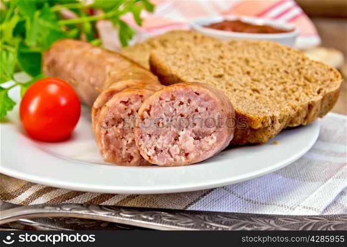 Pork sausages grilled in a plate, bread, sauce, tomato, parsley, napkin on the background of wooden boards