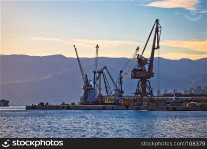 Port city of Rijeka cranes at harbor view, Kvarner bay, Croatia