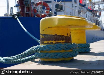 port detail and ship to fasten the mooring rope to the bollard