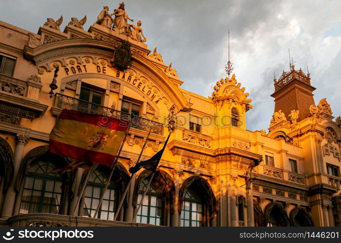 Port of Barcelona or Port de Barcelona old classic building facade under warm beautiful evening light - Bearcelona, Spain