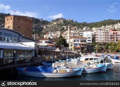 Port, red tower and castle in Alanya