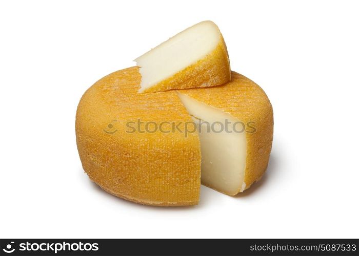 Port salut cheese with a slice on white background