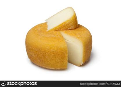 Port salut cheese with a slice on white background