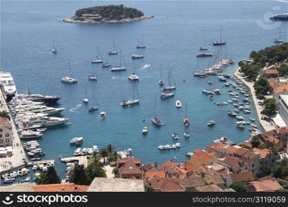 Port with boats and island in Hvar, Croatia