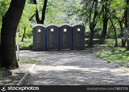 Portable public toilets outdoor in a row
