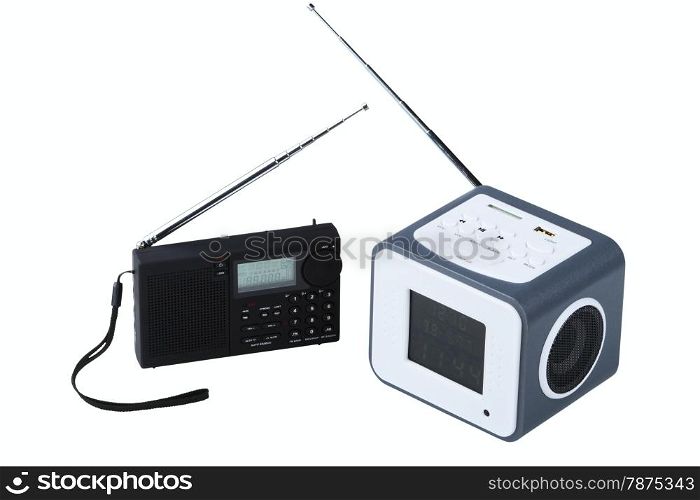 Portable radio receivers with alarm, card-reader, amplifier, remote control and MP3 player isolated on a white background