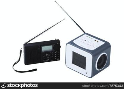 Portable radio receivers with alarm, card-reader, amplifier, remote control and MP3 player isolated on a white background