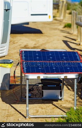 Portable solar photovoltaic panel, charging battery at c&er car rv. C&ing equipment. Solar photovoltaic panel at c&er caravan