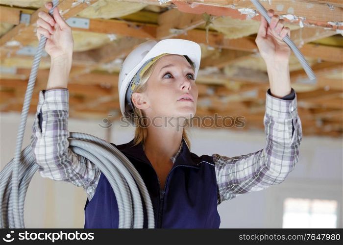 portait of a woman working with ceiling