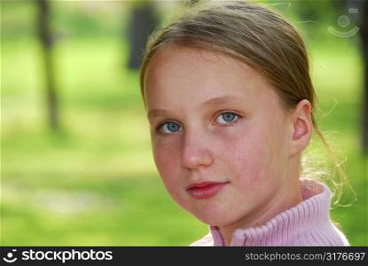 Portait of young girl on green background