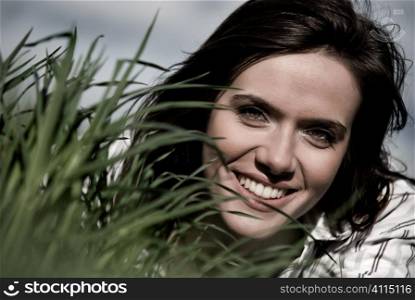 Portait of young woman in grass