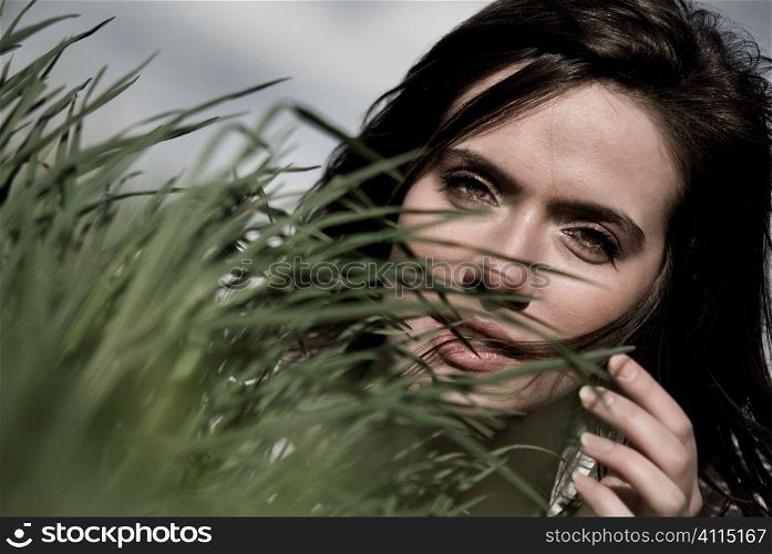 Portait of young woman in grass