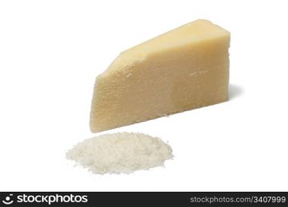 Portion and grated Parmesan cheese on white background