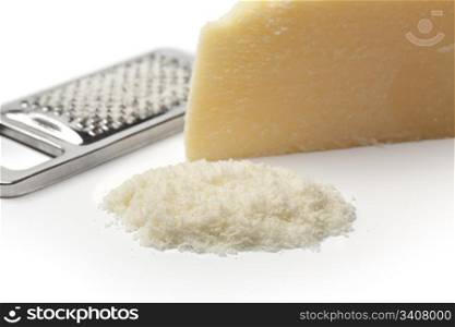 Portion and grated Parmesan cheese on white background