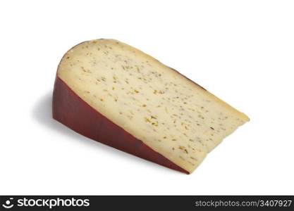 Portion Farmers Leiden cumin cheese on white background