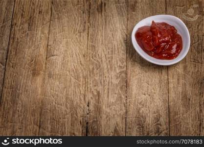 Portion of Barbeque Sauce on dark rustic background