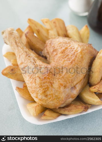 Portion Of Chicken And Chips On A Polystyrene Tray