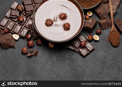 portion of Classic tiramisu dessert with raspberries and cup of espresso coffee on blue wooden background or table. portion of Classic tiramisu dessert with raspberries and cup of espresso coffee on blue wooden background