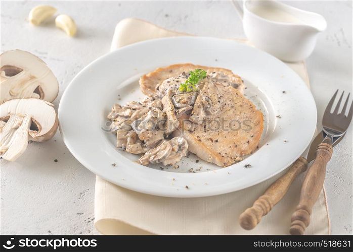 Portion of creamy garlic mushroom pork close-up