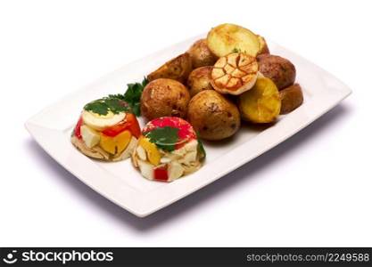 Portion of delicious chicken aspic and baked potato on a plate isolated on white background. High quality photo. Portion of delicious chicken aspic and baked potato on a plate isolated on white background