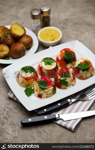 Portion of delicious chicken aspic on a plate isolated on concrete table. High quality photo. Portion of delicious chicken aspic on a plate isolated on concrete table