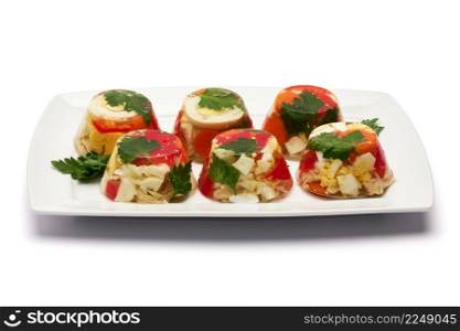 Portion of delicious chicken aspic on a plate isolated on white background. High quality photo. Portion of delicious chicken aspic on a plate isolated on white background