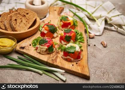 Portion of delicious chicken aspic on serving board on concrete table. High quality photo. Portion of delicious chicken aspic on serving board on concrete table