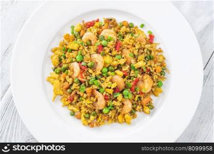 Portion of fried rice with eggs, vegetables and prawns