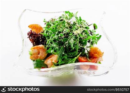 Portion of gourmet shrimp salad with arugula
