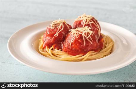 Portion of meatballs with tomato sauce and pasta: top view