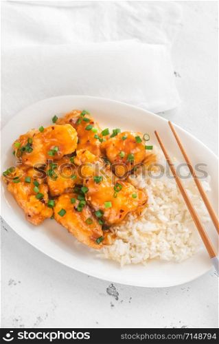 Portion of orange chicken and white rice
