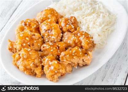 Portion of orange chicken with white rice