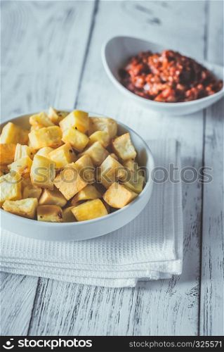Portion of patatas bravas with sauces