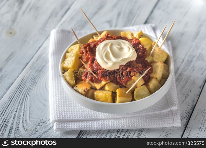 Portion of patatas bravas with sauces