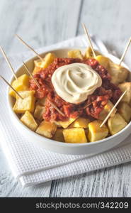 Portion of patatas bravas with sauces