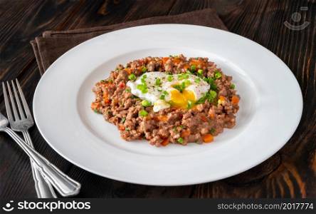 Portion of poached eggs with mince meat