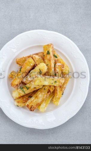 Portion of potato French fries on the plate