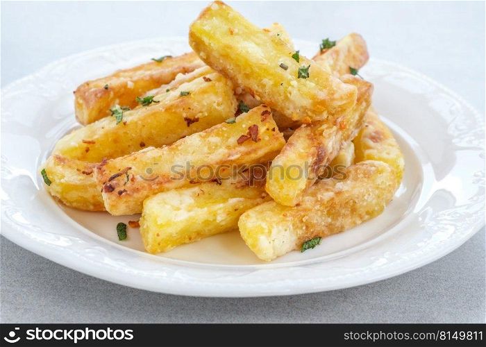 Portion of potato French fries on the plate