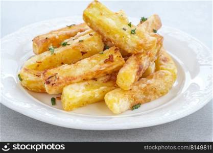 Portion of potato French fries on the plate