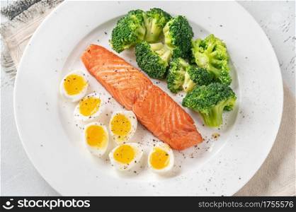 Portion of salmon with broccoli and eggs