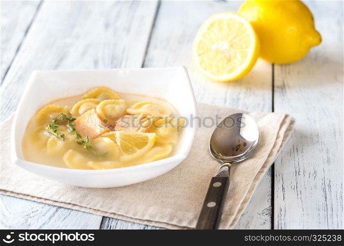 Portion of seafood ravioli soup