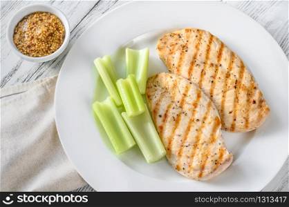 Portion of seasoned grilled chicken with Dijon mustard