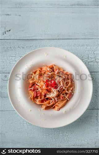 Portion of tagliatelle pasta with amatriciana sauce