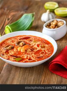 Portion of Tom Yum - famous Thai soup with ingredients