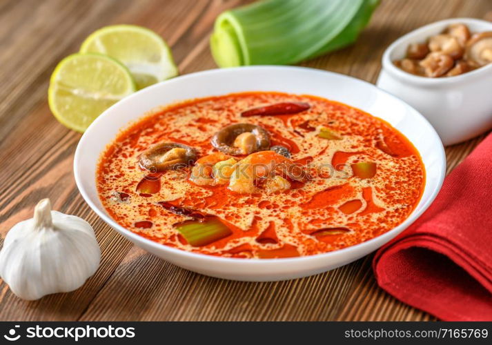 Portion of Tom Yum - famous Thai soup with ingredients