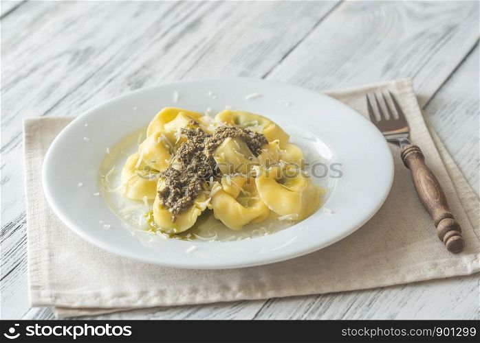 Portion of tortelloni stuffed with ricotta with pesto