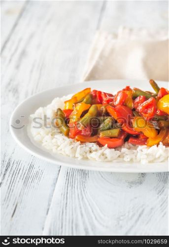 Portion of white rice and caramelized vegetables